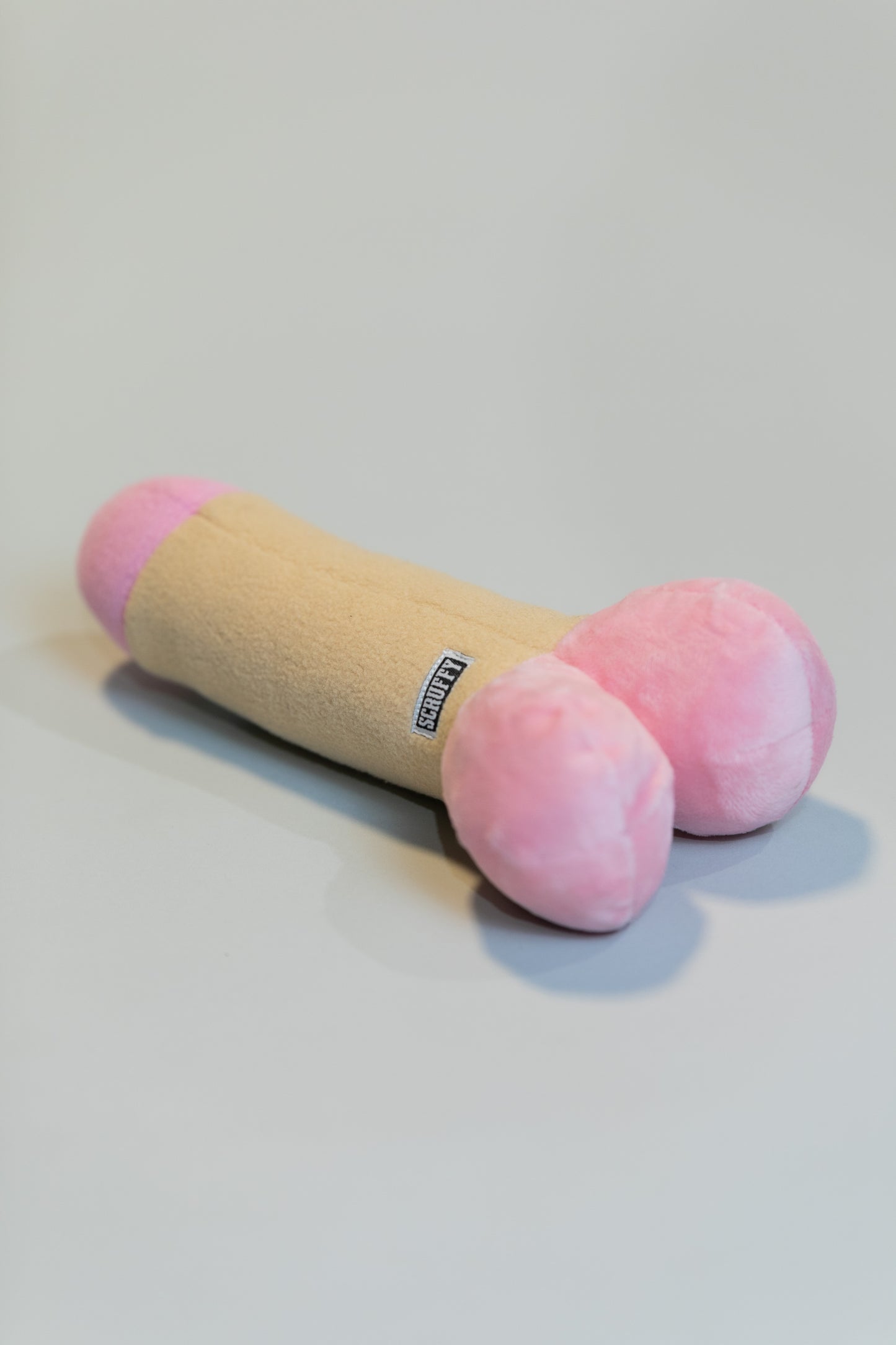 Scruffy Plushie Squeaky Dog Toy in the shape of a dildo